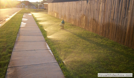 sprinklersagainstfence